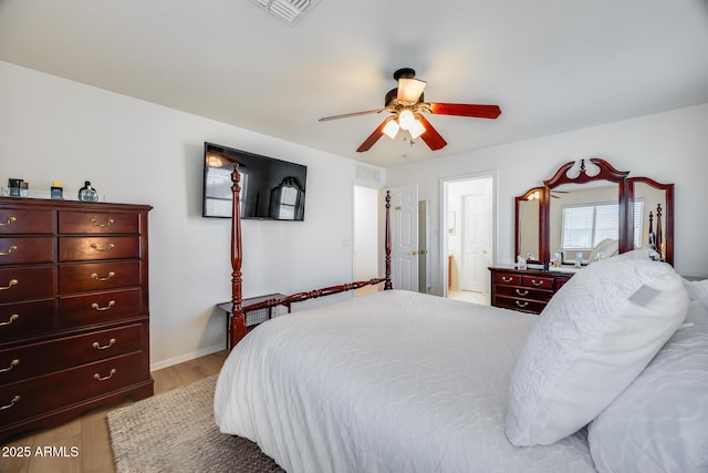 bedroom with visible vents, ceiling fan, and light wood-style floors