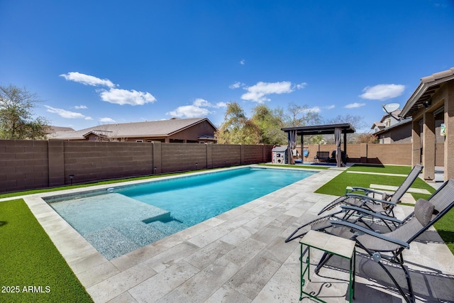 view of swimming pool with a patio area, a fenced backyard, a fenced in pool, and a lawn