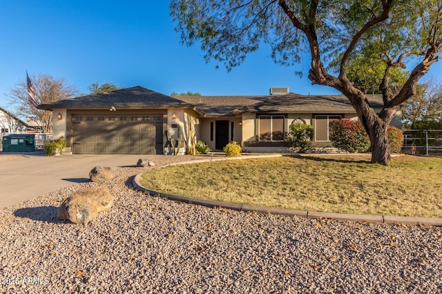 ranch-style house with a front yard and a garage