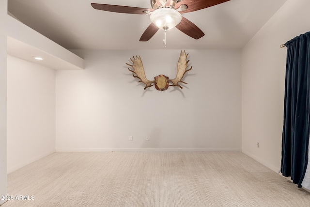 carpeted empty room with ceiling fan