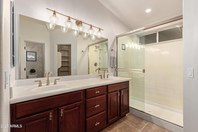 bathroom featuring vanity, tile patterned floors, and walk in shower