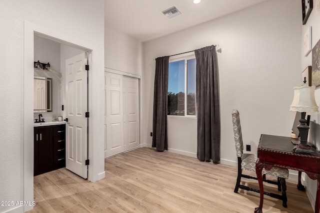 office featuring sink and light hardwood / wood-style flooring