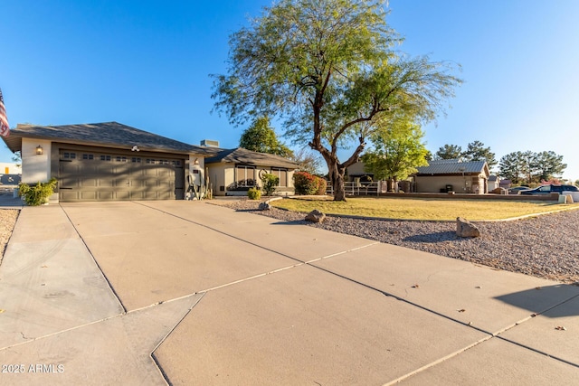 ranch-style house featuring a garage