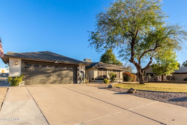 ranch-style home featuring a garage