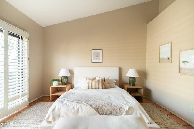 bedroom featuring lofted ceiling