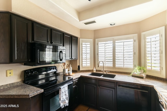 kitchen featuring sink, dark brown cabinets, and black appliances