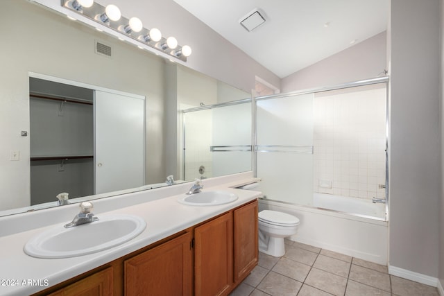 full bathroom with vaulted ceiling, vanity, enclosed tub / shower combo, tile patterned flooring, and toilet