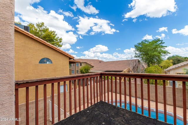 wooden deck featuring an outdoor pool