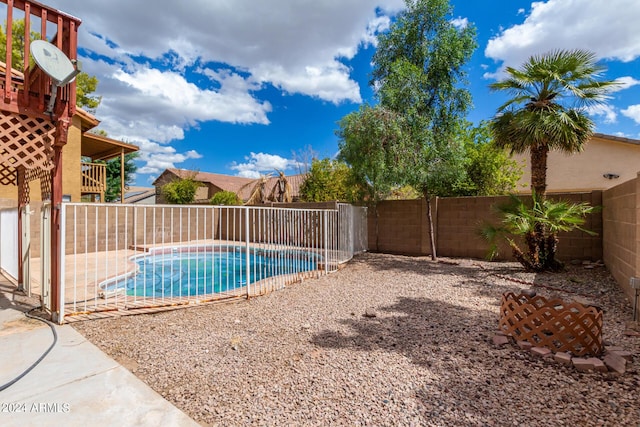view of pool featuring a fenced in pool and a fenced backyard