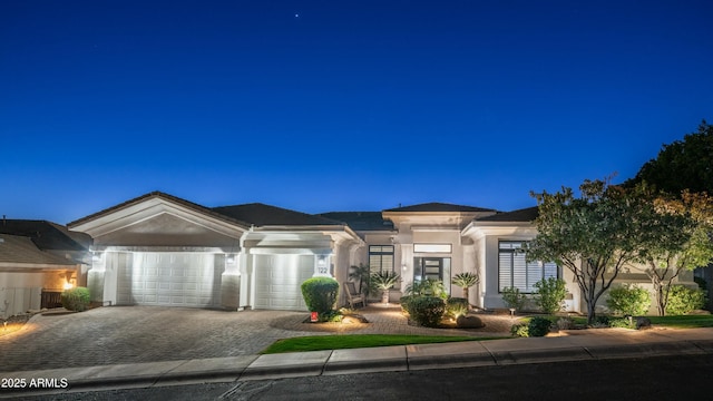 122 E Desert Wind Dr, Phoenix, AZ 85048 - prairie-style house with a garage, decorative driveway, and stucco siding