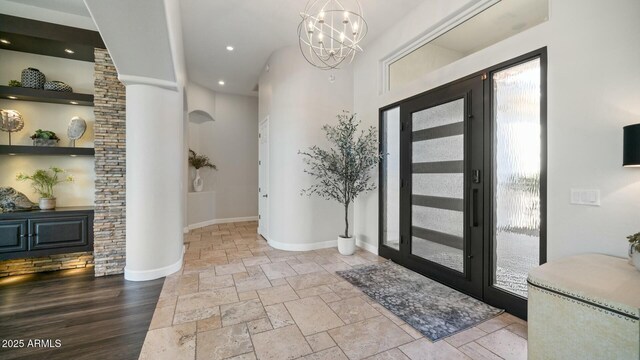 122 E Desert Wind Dr, Phoenix, AZ 85048 - foyer entrance featuring recessed lighting, stone tile flooring, baseboards, and an inviting chandelier