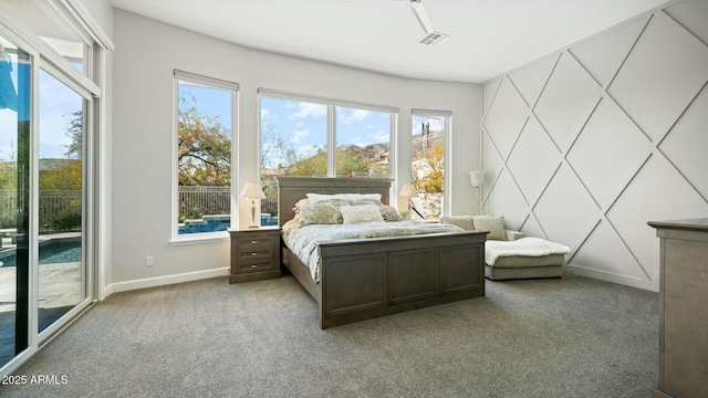 122 E Desert Wind Dr, Phoenix, AZ 85048 - carpeted bedroom with access to outside, visible vents, and baseboards