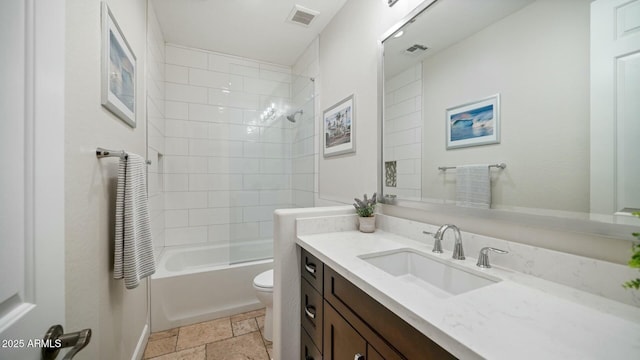 122 E Desert Wind Dr, Phoenix, AZ 85048 - bathroom with toilet, stone tile flooring, vanity, and visible vents