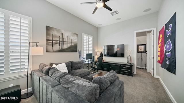 122 E Desert Wind Dr, Phoenix, AZ 85048 - carpeted living area with visible vents, ceiling fan, and baseboards