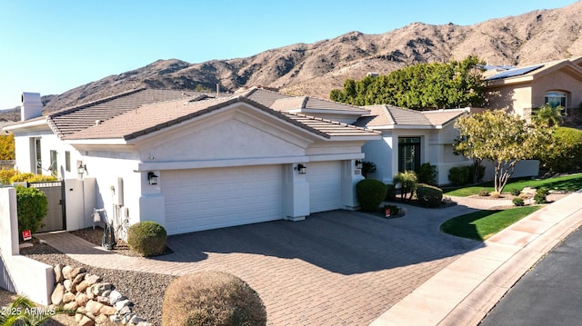 122 E Desert Wind Dr, Phoenix, AZ 85048 - single story home with a mountain view, a garage, a tile roof, decorative driveway, and stucco siding