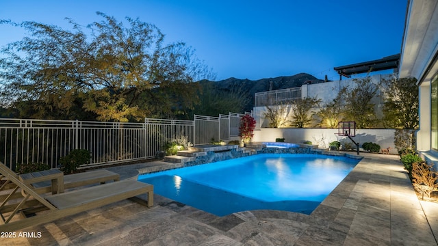 122 E Desert Wind Dr, Phoenix, AZ 85048 - view of swimming pool featuring a pool with connected hot tub, a patio area, a fenced backyard, and a mountain view