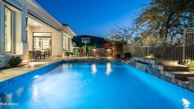 122 E Desert Wind Dr, Phoenix, AZ 85048 - view of swimming pool featuring a fenced in pool, outdoor dining space, fence, and a patio