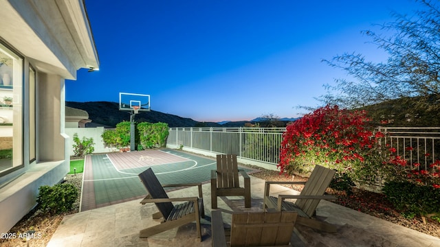 122 E Desert Wind Dr, Phoenix, AZ 85048 - view of sport court featuring fence, a mountain view, and basketball court