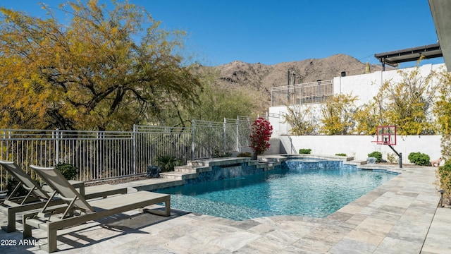 122 E Desert Wind Dr, Phoenix, AZ 85048 - view of pool featuring a pool with connected hot tub, a patio area, fence, and a mountain view