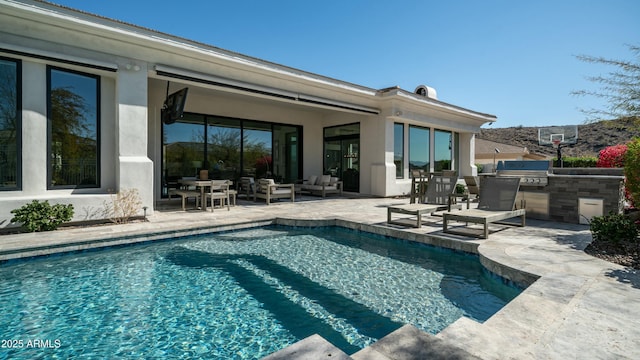 122 E Desert Wind Dr, Phoenix, AZ 85048 - outdoor pool featuring a patio area, an outdoor hangout area, an outdoor kitchen, and a grill