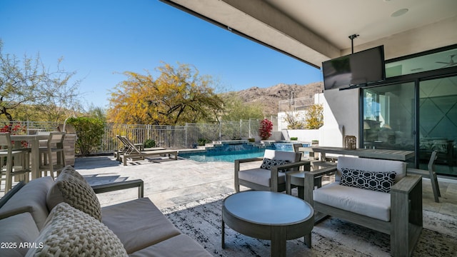 122 E Desert Wind Dr, Phoenix, AZ 85048 - view of patio / terrace with a pool with connected hot tub, fence, and outdoor dining space