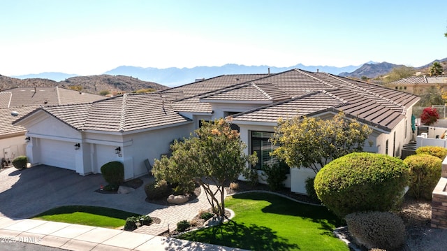 122 E Desert Wind Dr, Phoenix, AZ 85048 - view of front of home with driveway, an attached garage, a tile roof, and a mountain view