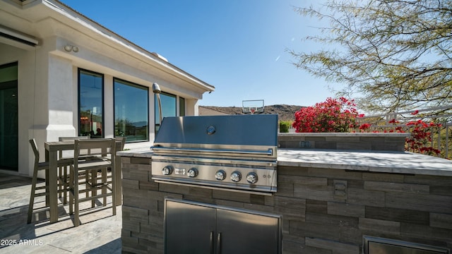 122 E Desert Wind Dr, Phoenix, AZ 85048 - view of patio / terrace featuring outdoor dining space, a mountain view, grilling area, and area for grilling