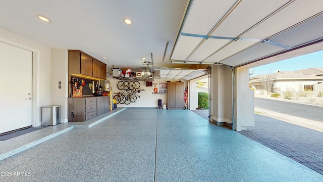 122 E Desert Wind Dr, Phoenix, AZ 85048 - garage with baseboards, a garage door opener, and recessed lighting