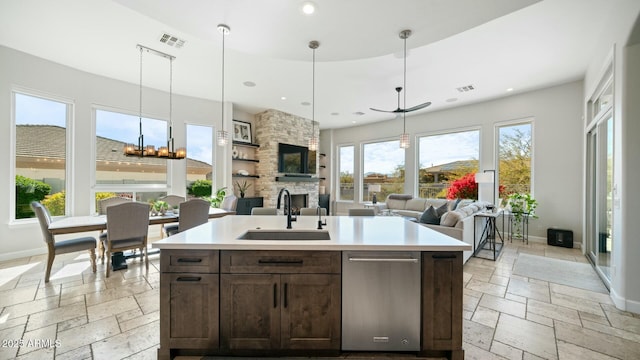 122 E Desert Wind Dr, Phoenix, AZ 85048 - kitchen with visible vents, a sink, stone tile flooring, and baseboards