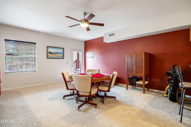 dining area with carpet flooring and ceiling fan