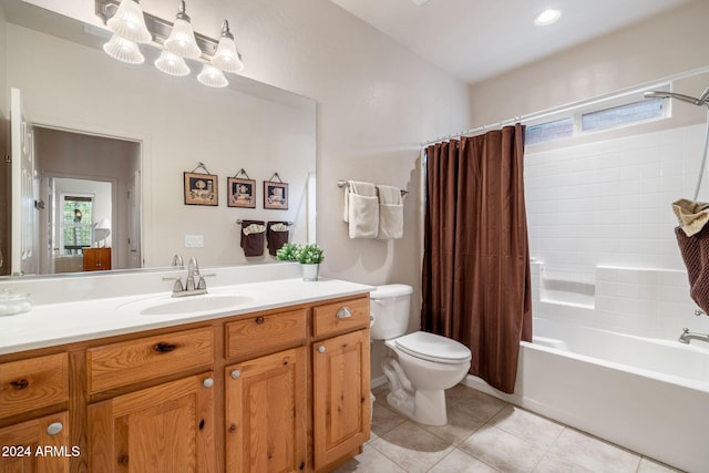 full bathroom with tile patterned flooring, shower / bath combination with curtain, vanity, and a healthy amount of sunlight