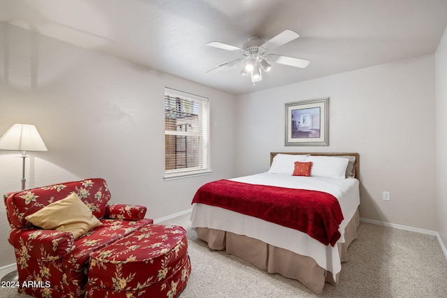 bedroom with light colored carpet and ceiling fan