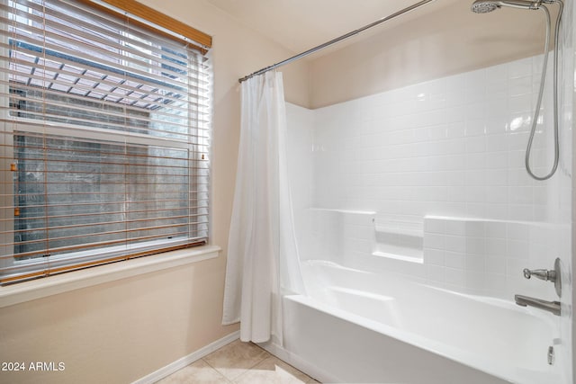 bathroom featuring tile patterned flooring and shower / bathtub combination with curtain