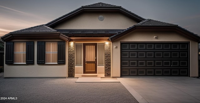 view of front of property with a garage