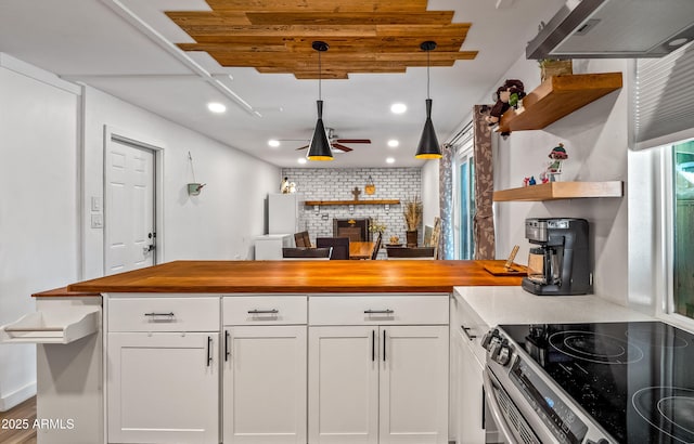 8116 N 55th Dr, Glendale, AZ 85302 - kitchen featuring wooden counters, open shelves, a peninsula, tasteful backsplash, and white cabinetry
