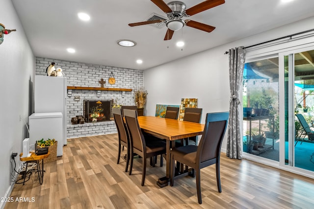 8116 N 55th Dr, Glendale, AZ 85302 - dining room featuring wood finished floors, ceiling fan, a fireplace, and recessed lighting