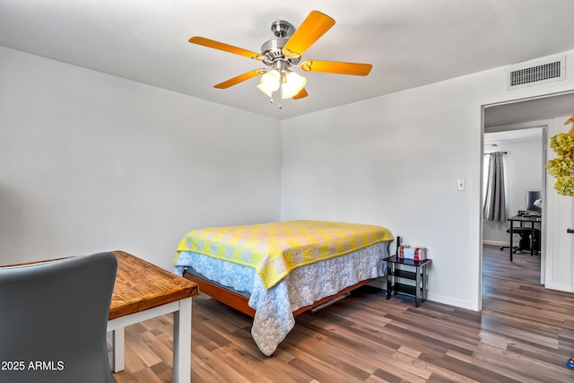 8116 N 55th Dr, Glendale, AZ 85302 - bedroom featuring wood finished floors and a ceiling fan