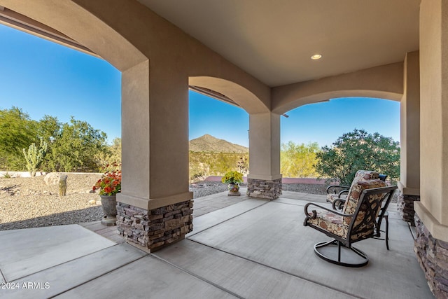 view of patio / terrace featuring a mountain view