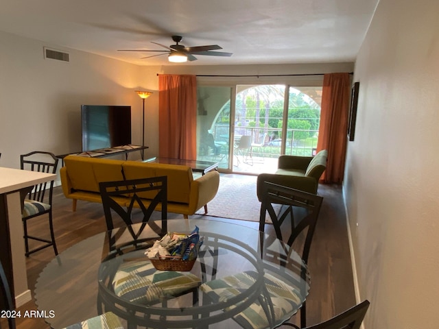 living room with hardwood / wood-style floors and ceiling fan