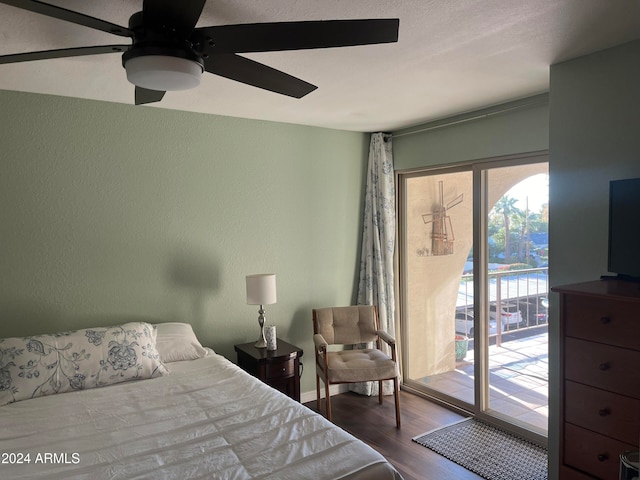 bedroom with hardwood / wood-style floors, access to outside, and ceiling fan