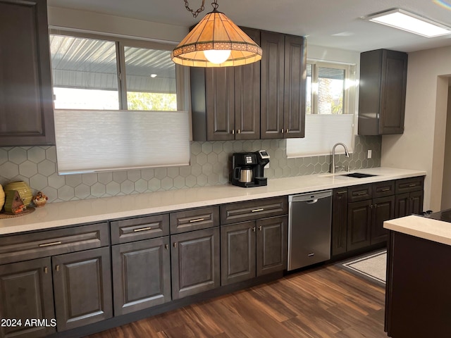 kitchen with dishwasher, dark hardwood / wood-style flooring, decorative light fixtures, and tasteful backsplash