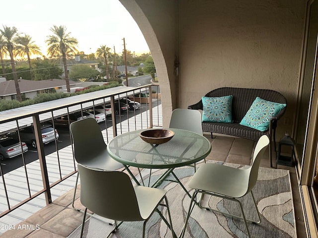 view of balcony at dusk