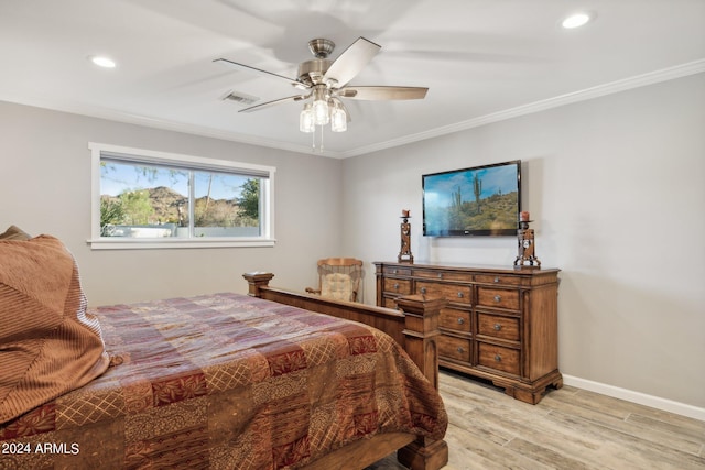 bedroom featuring light wood-type flooring, ceiling fan, and ornamental molding