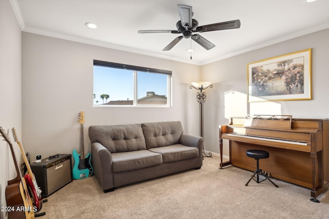 carpeted living room with ceiling fan and ornamental molding