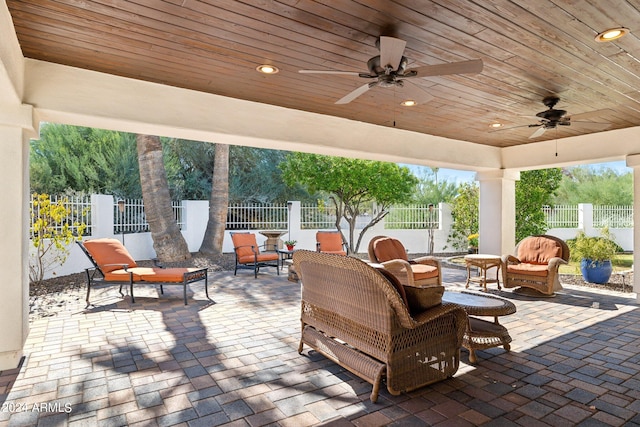 view of patio featuring ceiling fan and an outdoor living space