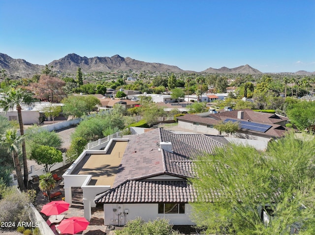 birds eye view of property with a mountain view