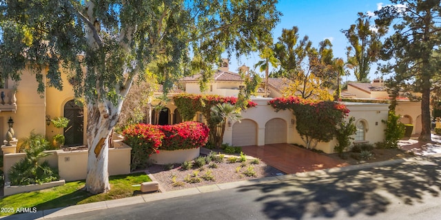 mediterranean / spanish-style house featuring a garage