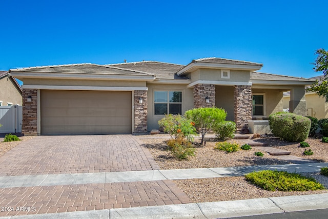 prairie-style home featuring a garage