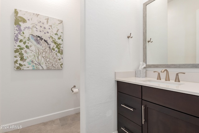 bathroom with tile flooring and vanity