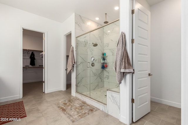 bathroom featuring walk in shower and tile floors